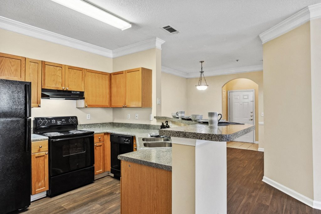 Kitchen with black appliances at Longwood Vista Apartment Homes in Atlanta GA